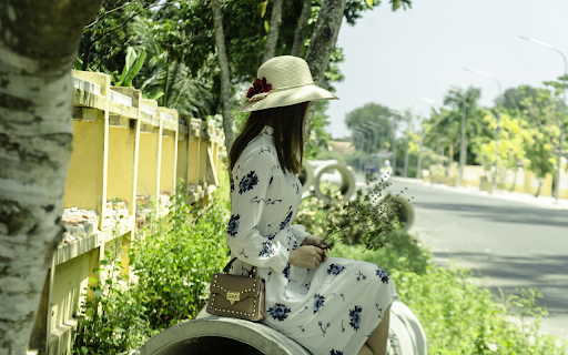 Girl sitting on a round drain  from Chrome web store to be run with OffiDocs Chromium online