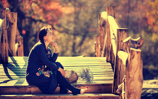 Girl sitting on wooden bridge  from Chrome web store to be run with OffiDocs Chromium online