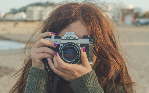 Girl taking pictures  from Chrome web store to be run with OffiDocs Chromium online