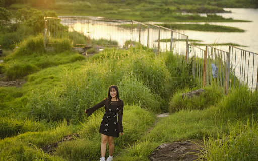 Girl walking by the river  from Chrome web store to be run with OffiDocs Chromium online