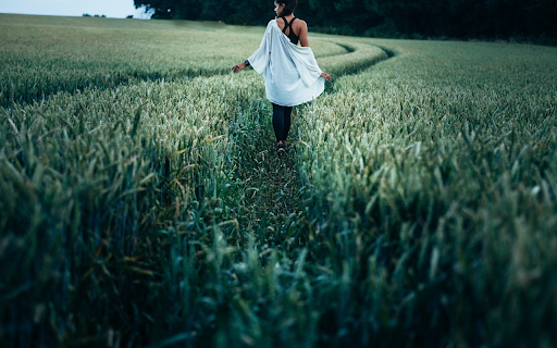 Girl walking on green field  from Chrome web store to be run with OffiDocs Chromium online