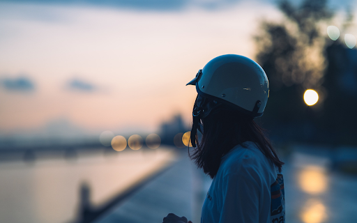 Girl wearing a helmet by the river  from Chrome web store to be run with OffiDocs Chromium online