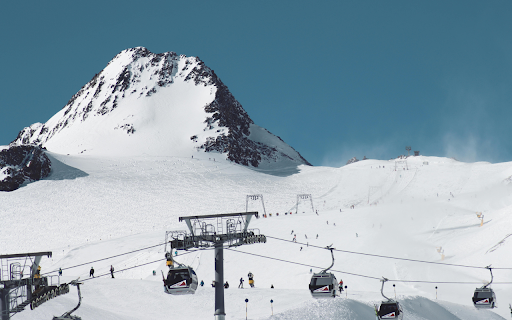 Gondolas Near Snow Covered Mountain  from Chrome web store to be run with OffiDocs Chromium online