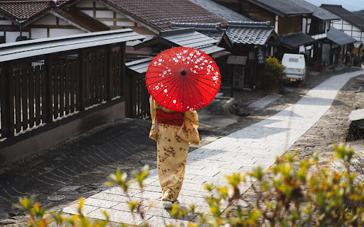 Japanese girl holding a red umbrella walking  from Chrome web store to be run with OffiDocs Chromium online