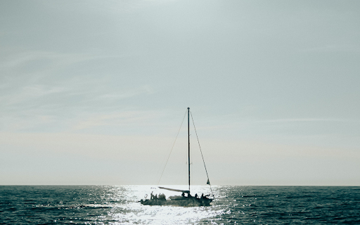 Landscape Photography of a Sailboat at Sea  from Chrome web store to be run with OffiDocs Chromium online