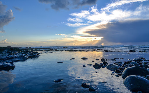 landscape sea covered rocks sunlight cloudy sky sunset  from Chrome web store to be run with OffiDocs Chromium online