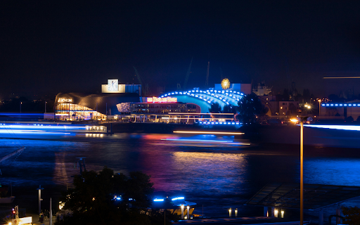Lighted Building Near Body of Water during Night Time  from Chrome web store to be run with OffiDocs Chromium online