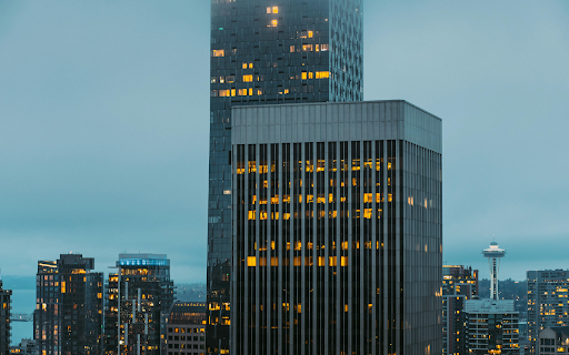 Lights in Windows of Glass Skyscrapers in City  from Chrome web store to be run with OffiDocs Chromium online