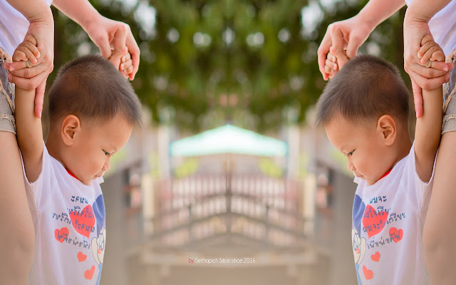 Little boy holding his mothers hand.  from Chrome web store to be run with OffiDocs Chromium online