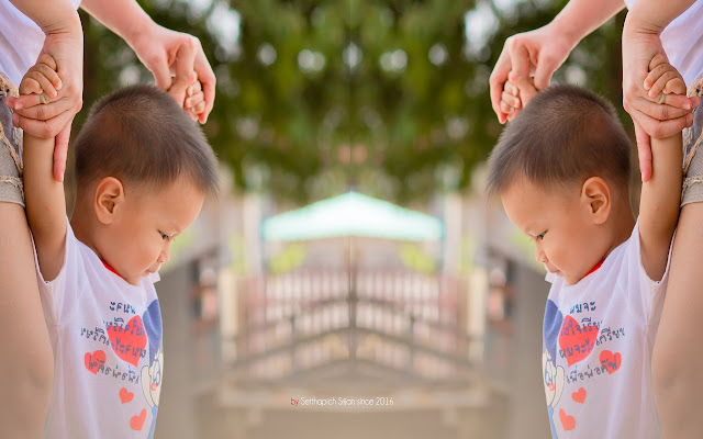 Little boy holding his mothers hand.  from Chrome web store to be run with OffiDocs Chromium online