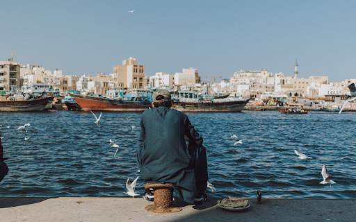 Man fishing on the pier  from Chrome web store to be run with OffiDocs Chromium online
