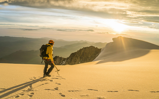 Man Hiking in Mountains at Sunset  from Chrome web store to be run with OffiDocs Chromium online