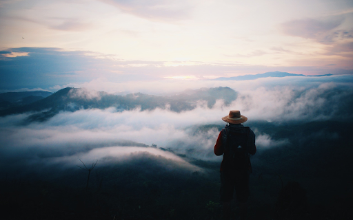 Man looking at mountains  from Chrome web store to be run with OffiDocs Chromium online