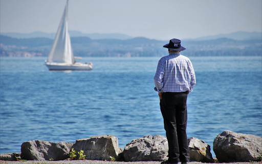 Men looking at boats  from Chrome web store to be run with OffiDocs Chromium online