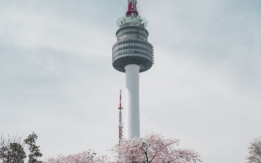 Modern Landmark Amidst Spring Bloom  from Chrome web store to be run with OffiDocs Chromium online