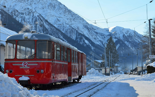 Narrow Gauge Railway Train at a Station in the French Alps  from Chrome web store to be run with OffiDocs Chromium online