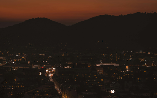 Nighttime Cityscape of Graz with Vibrant Skyline  from Chrome web store to be run with OffiDocs Chromium online