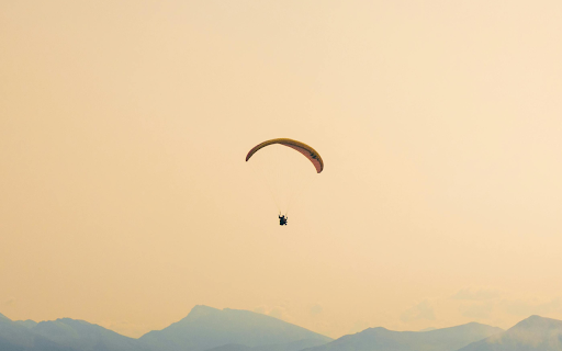 Paragliding in the mountains  from Chrome web store to be run with OffiDocs Chromium online