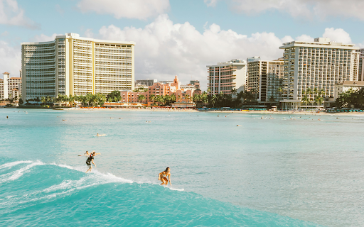 People In Hotel Surfing the Sea Waves  from Chrome web store to be run with OffiDocs Chromium online