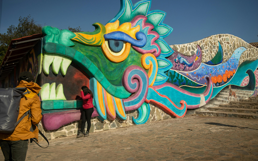 People Standing Beside Multicolored Wall Painting  from Chrome web store to be run with OffiDocs Chromium online