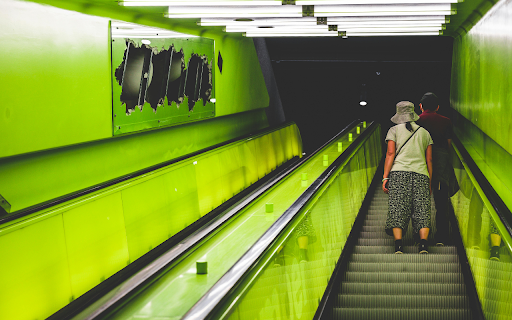People Standing on the Escalator  from Chrome web store to be run with OffiDocs Chromium online