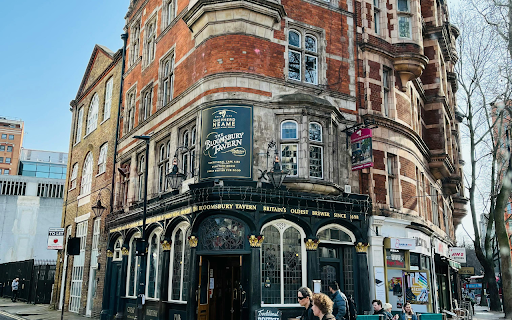 People Walking Outside the Bloomsbury Tavern  from Chrome web store to be run with OffiDocs Chromium online