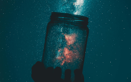 Person Holding Glass Mason Jar Under A Starry Sky  from Chrome web store to be run with OffiDocs Chromium online