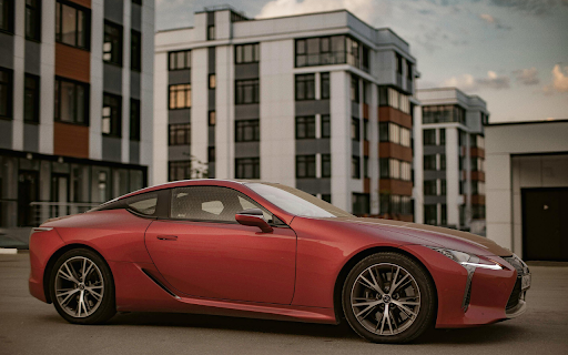 Photo of Red Coupe Parked in Pavement  from Chrome web store to be run with OffiDocs Chromium online
