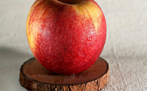 Red apple on wooden base  from Chrome web store to be run with OffiDocs Chromium online