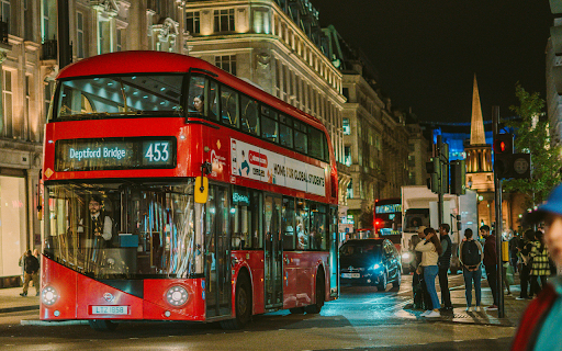 Red Double Decker on Oxford Street in London at Night  from Chrome web store to be run with OffiDocs Chromium online