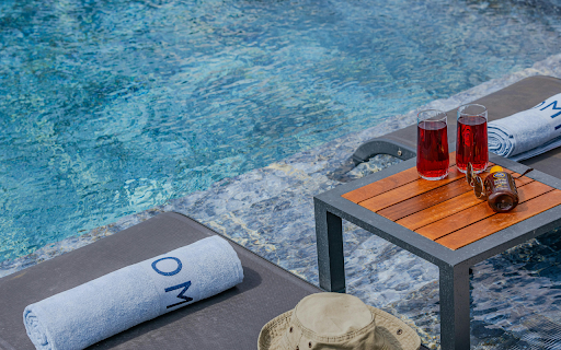 Red Drinks on a Poolside Table  from Chrome web store to be run with OffiDocs Chromium online