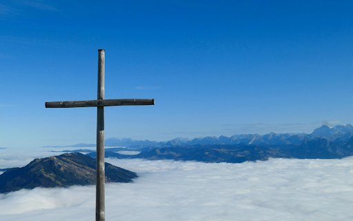 Scenic View of Swiss Alps with Mountain Cross  from Chrome web store to be run with OffiDocs Chromium online