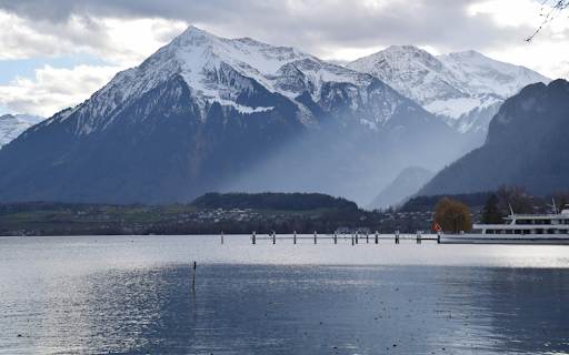 Serene Alpine Lake and Snowy Mountains Landscape  from Chrome web store to be run with OffiDocs Chromium online
