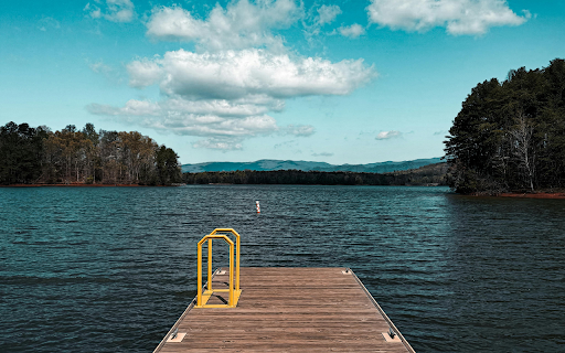 Serene Wooden Dock Overlooking Calming Lake View  from Chrome web store to be run with OffiDocs Chromium online