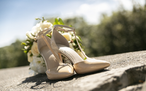 Shoes next to wedding flowers  from Chrome web store to be run with OffiDocs Chromium online