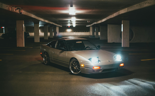 Silver Car Parked with Lights On  from Chrome web store to be run with OffiDocs Chromium online