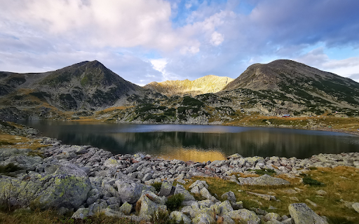 Small tent next to the mountain and lake  from Chrome web store to be run with OffiDocs Chromium online