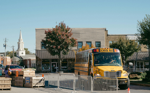 Small Town Street Scene with School Bus in Fall  from Chrome web store to be run with OffiDocs Chromium online