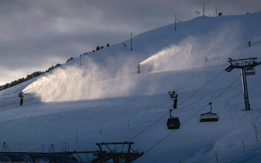 Snow Cannons Producing Snow on a Mountain Slope  from Chrome web store to be run with OffiDocs Chromium online