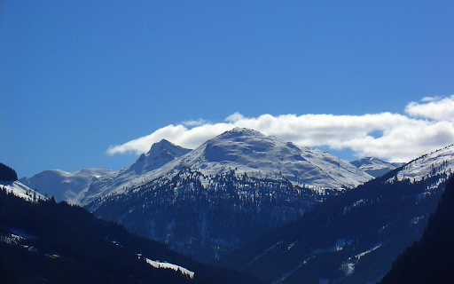 Snow capped mountains bask in the soft  from Chrome web store to be run with OffiDocs Chromium online