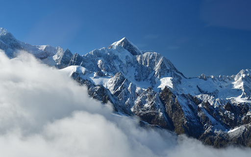 Snow Capped Peaks Above the Clouds  from Chrome web store to be run with OffiDocs Chromium online
