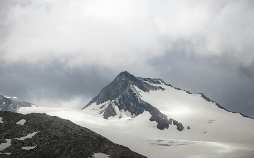 Snow Covered Mountain Peak in Tirol, Austria  from Chrome web store to be run with OffiDocs Chromium online