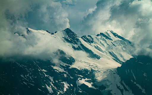 Snow Covered Mountain Under Cloudy Sky  from Chrome web store to be run with OffiDocs Chromium online