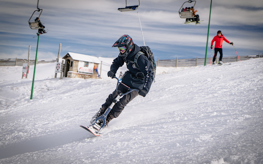 Snowmobile and Man  from Chrome web store to be run with OffiDocs Chromium online