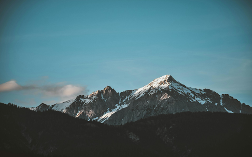Snowy Mountain Peak Under Clear Sky  from Chrome web store to be run with OffiDocs Chromium online