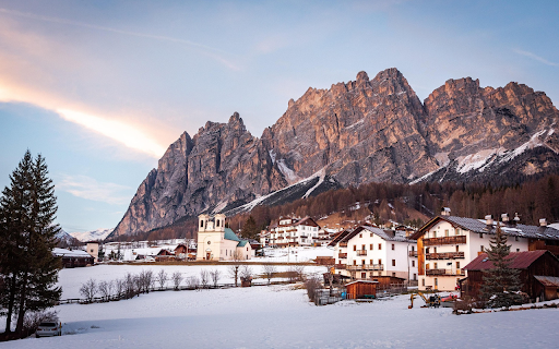 Snowy Village Beneath Majestic Peaks  from Chrome web store to be run with OffiDocs Chromium online