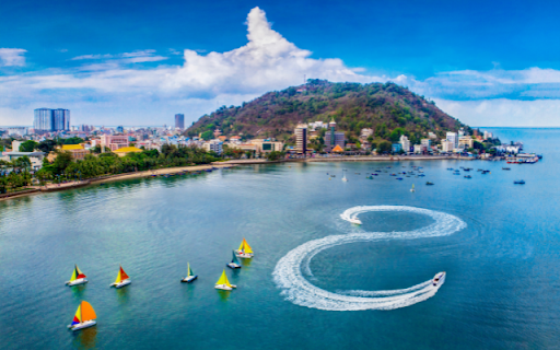 S Shaped Canoe Gliding on the Sea Beside an Island  from Chrome web store to be run with OffiDocs Chromium online
