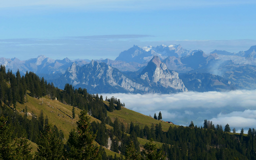 Stunning View of Swiss Alps with Foggy Landscape  from Chrome web store to be run with OffiDocs Chromium online