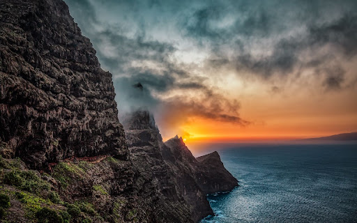 Sunset on the rock Browser Theme  from Chrome web store to be run with OffiDocs Chromium online