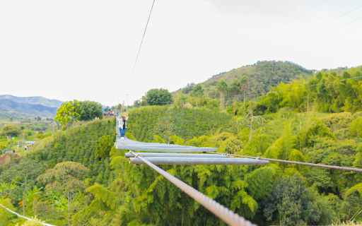 Suspension bridge over green hills  from Chrome web store to be run with OffiDocs Chromium online